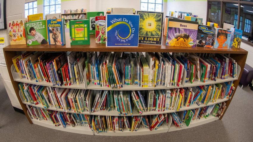 Books sit on shelves in an elementary school library in suburban Atlanta on Friday, 18, 2023.