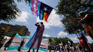 FILE – Demonstrators gather on the steps to the Texas Capitol to speak against transgender-related legislation bills being considered in the Texas Senate and House, May 20, 2021, in Austin, Texas. The Texas Supreme Court will allow the new state law banning gender-affirming care for minors to take effect on Friday, Sept. 1, 2023, setting up Texas to be the most populous state with such restrictions on transgender children.