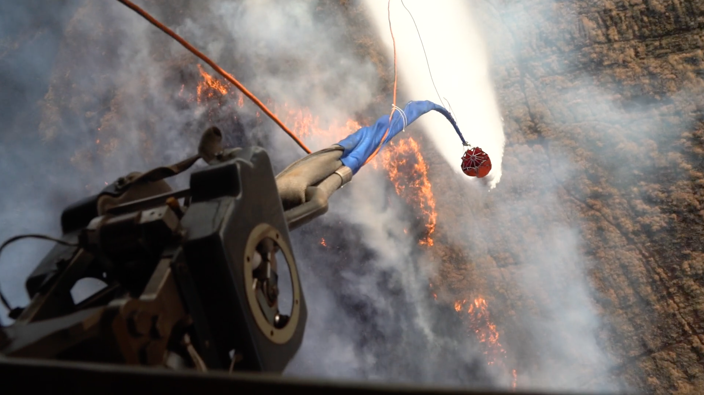 Hawaii Army National Guard helicopters fight wildfires with bucket drops, Aug. 9, 2023, in Maui, Hawaii. The National Guard said they dropped more than 100,000 gallons of water on the fires.