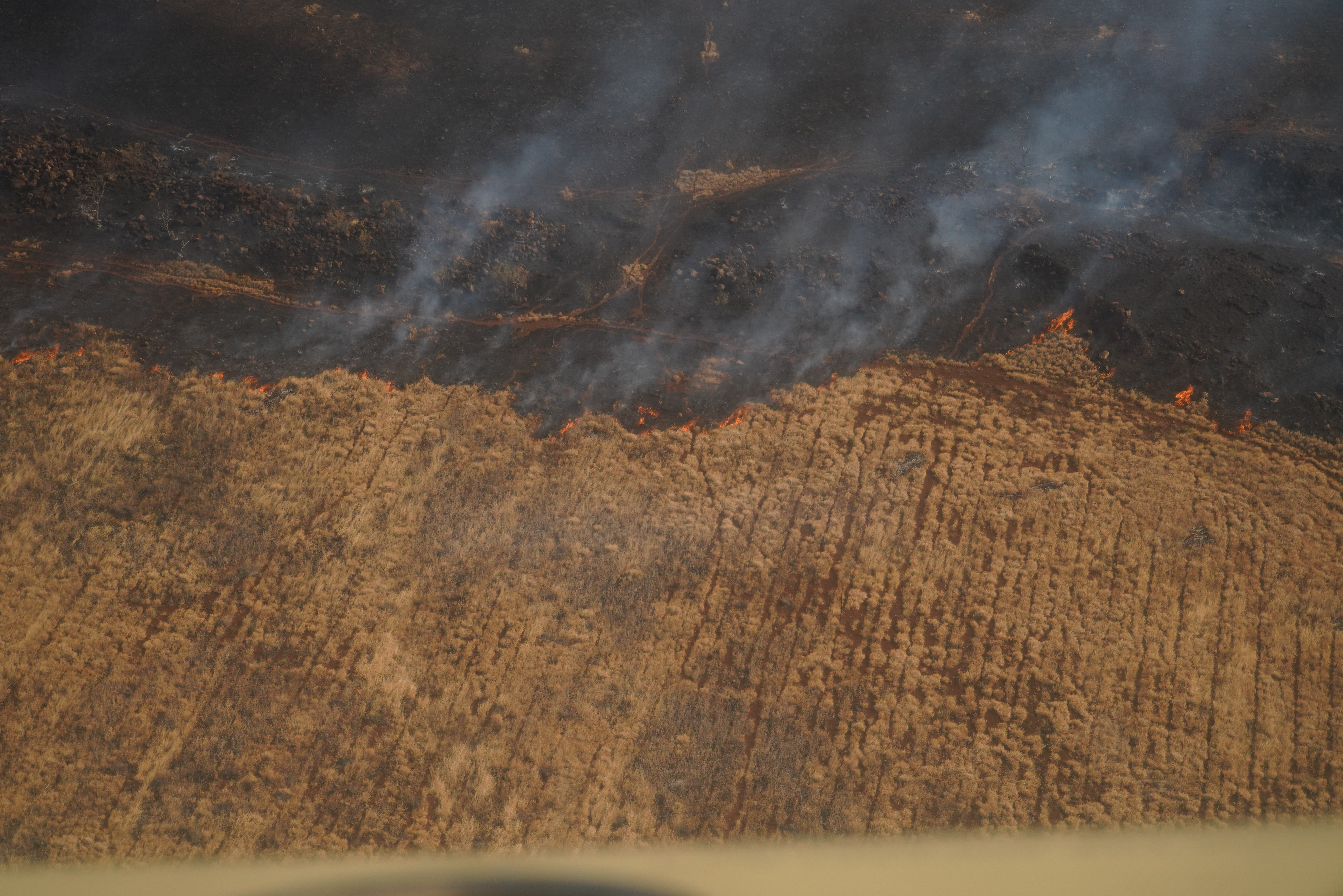 Hawaii Army National Guard helicopters fight wildfires with bucket drops, Aug. 9, 2023, in Maui, Hawaii. The National Guard said they dropped more than 100,000 gallons of water on the fires.