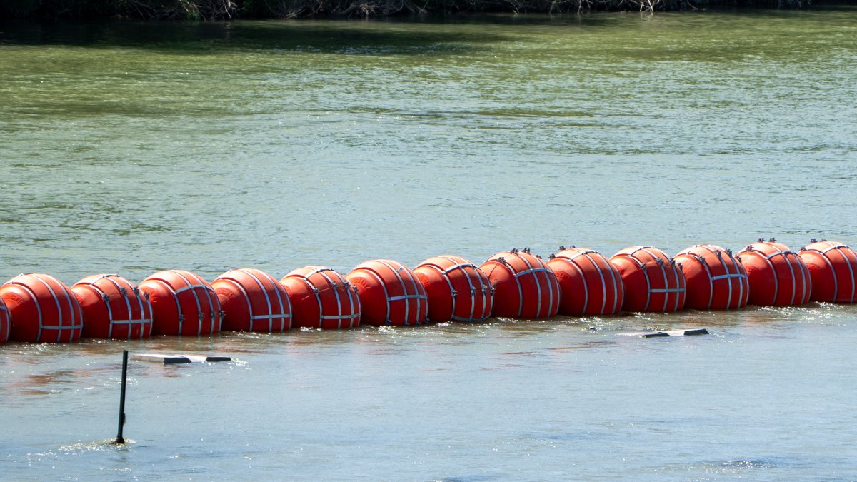 Justice Department tells Texas that floating barrier on Rio Grande