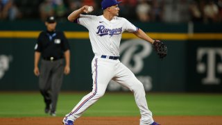 ARLINGTON, TEXAS – AUGUST 02: Corey Seager #5 of the Texas Rangers throws to first base in the first inning against the Chicago White Soxat Globe Life Field on August 02, 2023 in Arlington, Texas. (Photo by Tim Heitman/Getty Images)