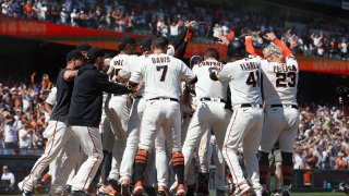 SAN FRANCISCO, CALIFORNIA – AUGUST 13: Patrick Bailey #14 of the San Francisco Giants celebrates with teammates after hitting a two-run walk-off home run in the bottom of the tenth inning against the Texas Rangers at Oracle Park on August 13, 2023 in San Francisco, California.