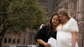 Lauren Miller, right, embraces Anna Zargarian after speaking as part of an announcement that the case Zurawski v. State of Texas has been filed, at Texas State Capitol in Austin, Texas, Tuesday, March 7, 2023. The women are two of five plaintiffs in the case that were denied medical care while experiencing pregnancy complications that threatened their health and lives. The lawsuit asks for clarification of the "medical emergency" exceptions in Texas' abortion law- S.B. 8. (Sara Diggins/Austin American-Statesman via AP)(Sara Diggins / ASSOCIATED PRESS)