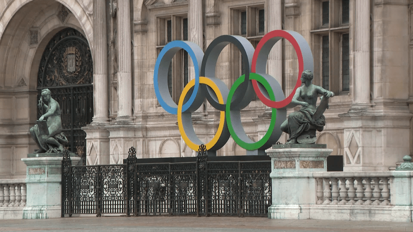 Olympic rings in front of French building