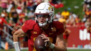 Quarterback Hunter Dekkers #12 of the Iowa State Cyclones scrambles for yards in the second half of play at Jack Trice Stadium on September 24, 2022 in Ames, Iowa.