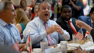 Former New Jersey Gov. Chris Christie greets people during a campaign event at the Casa Cuba Restaurant on August 18, 2023 in Miami, Florida.