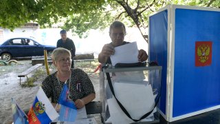 A man casts his ballot at a mobile polling station during early voting for local elections organised by the Russian-installed authorities in Donetsk, Russian-controlled Ukraine, on September 6, 2023, amid the ongoing conflict between the two countries.