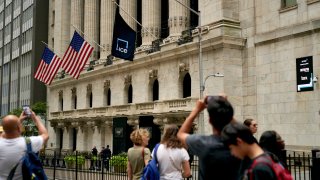 Pedestrians near the New York Stock Exchange (NYSE) in New York, US, on Monday, Aug. 28, 2023.