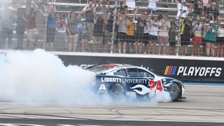 William Byron (No. 24 Hendrick Motorsports Liberty University Chevrolet) performs a burnout after winning the NASCAR Cup Series Playoff Autotrader EchoPark Automotive 400 on Sept. 24,2023 at Texas Motor Speedway in Fort Worth, Texas.