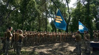 Soldiers of Ukraine's 3rd Separate Assault Brigade shout slogans