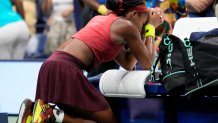 Coco Gauff, of the United States, kneels in prayer after defeating Aryna Sabalenka, of Belarus, in the women's singles final of the U.S. Open tennis championships, Saturday, Sept. 9, 2023, in New York. 