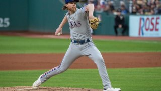 Texas Rangers starting pitcher Jon Gray delivers against the Cleveland Guardians during the first inning of a baseball game in Cleveland, Friday, Sept. 15, 2023. (AP Photo/Phil Long)