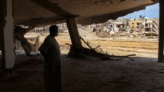 Derna flood survivor Abdul Salam Anwisi looks at the destroyed homes following flooding caused by Mediterranean storm Daniel, in Derna, Libya.