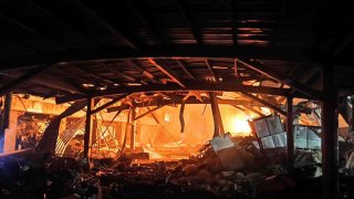 This image provided by the Pingtung County Government shows a factory fire at golf ball manufacturer Launch Technologies Co. in the southern county of Pingtung in Taiwan on Friday, Sept. 22, 2023. The factory fire has left multiple people killed, and the victims include several firefighters, according to Taiwanese media reports.