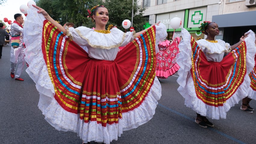 File. MADRID, SPAIN – 2022/10/08: Women wearing costumes of people of Latin American origin dance during the Hispanic Heritage 2022 parade in Madrid. The hypanidad festival has been considered a memorable day, after the time of the first contact between Europe and America, culminating the so-called “encounter of two worlds”, which transformed the visions of the world and the lives of both Europeans and Americans.