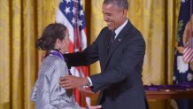 US President Barack Obama presents the National Medal of Arts to Julia Alvarez, novelist, poet, and essayist, during a ceremony in the East Room of the White House on July 28, 2014 in Washington, DC. AFP PHOTO/Mandel NGAN        (Photo credit should read MANDEL NGAN/AFP via Getty Images)