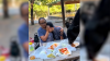 Video shows Mexican mother shielding son as bear leaps on picnic table, devours tacos