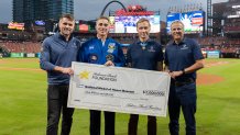 Anheuser-Busch presents a check for  million to support the ongoing construction of The National Medal of Honor Museum in Arlington, Texas, Sept. 20, 2023. Pictured L-R: A-B CEO Brendan Whitworth, NMOHM CEO Chris Cassidy, Medal of Honor recipient Britt Slabinski and Cesar Vargas, Anheuser-Busch U.S. chief external affairs officer.