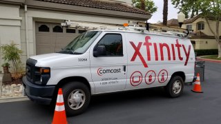 Comcast Xfinity cable television installation truck parked on a street in front of a suburban home, San Ramon, California, May 17, 2018. (Photo by Smith Collection/Gado/Getty Images)