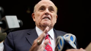 Former Mayor of New York Rudy Giuliani speaks to reporters as he leaves his apartment building in New York on Aug. 23, 2023.