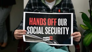 An activist at the offices of Rep. Michelle Park Steel in Cypress, California, on Feb. 24, 2023