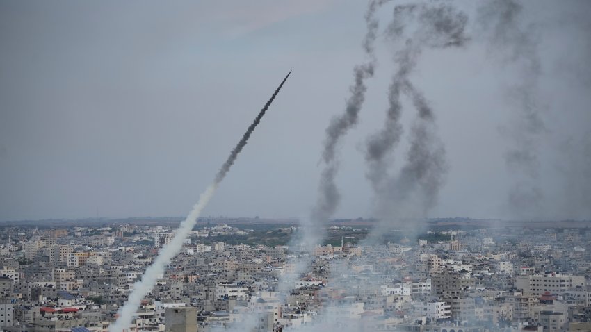 Rockets are launched by Palestinian militants from the Gaza Strip towards Israel, in Gaza, Saturday, Oct. 7, 2023. The militant Hamas rulers of the Gaza Strip carried out an unprecedented, multi-front attack on Israel at daybreak Saturday, firing thousands of rockets as dozens of Hamas fighters infiltrated the heavily fortified border in several locations by air, land, and sea and catching the country off-guard on a major holiday.