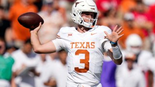 Texas quarterback Quinn Ewerslooks to throw a pass during the first half of an NCAA college football game against Houston, Saturday, Oct. 21, 2023, in Houston.