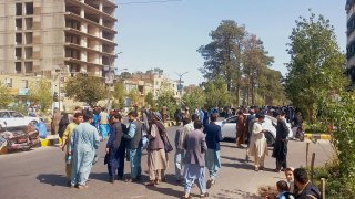 People gather on the streets in Herat on October 7, 2023. A magnitude 6.3 earthquake hit western Afghanistan October 7 morning, the United States Geological Survey said, followed by four large aftershocks with epicentres close to the region’s largest city.