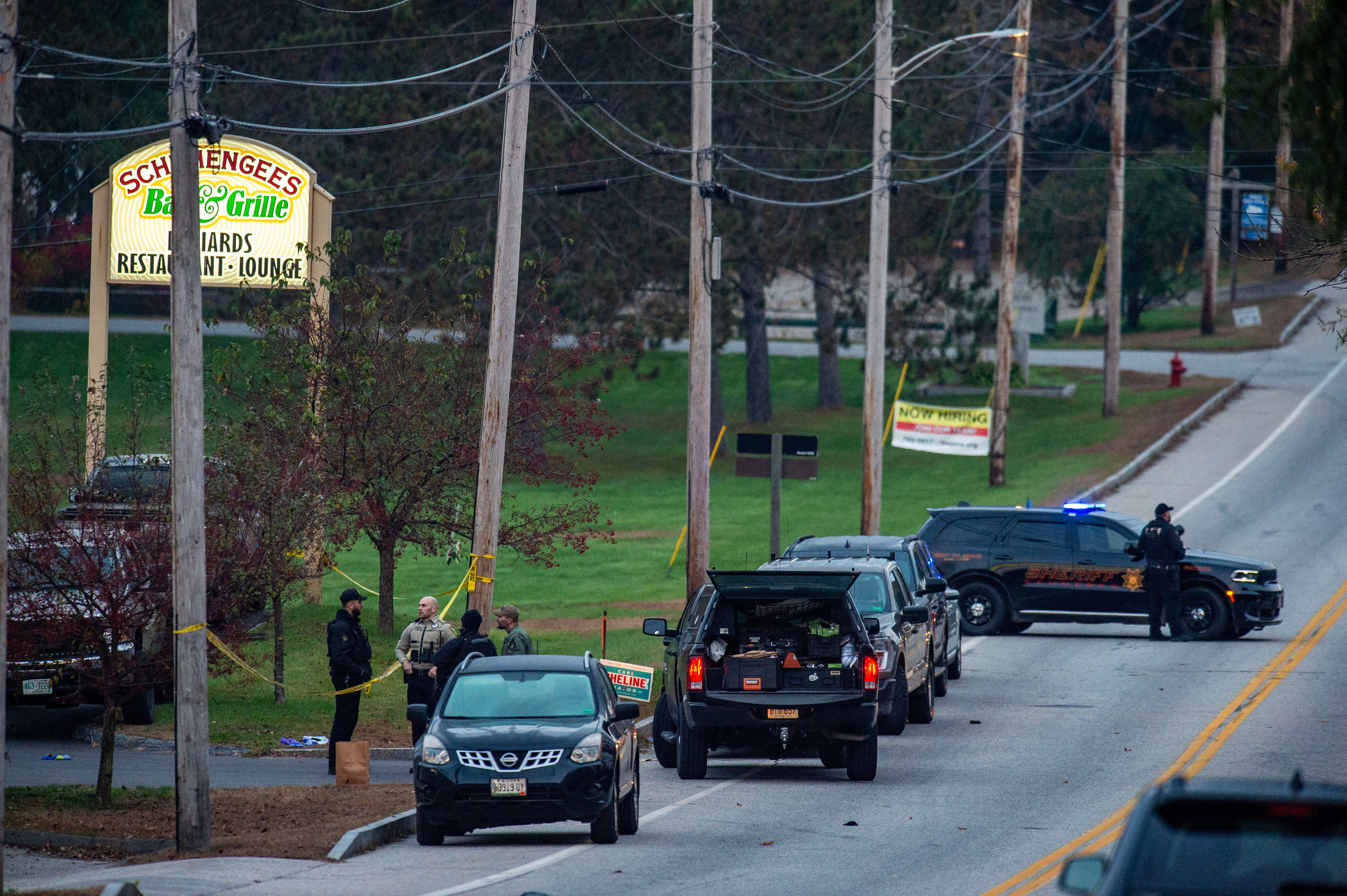 Police presence at Schemengees Bar, one of the locations where the Lewiston mass shooting occured, on Thursday, Oct. 26.