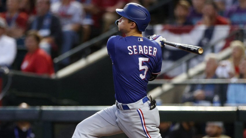 PHOENIX, ARIZONA – OCTOBER 30: Corey Seager #5 of the Texas Rangers hits a home run in the third inning against the Arizona Diamondbacks during Game Three of the World Series at Chase Field on October 30, 2023 in Phoenix, Arizona.