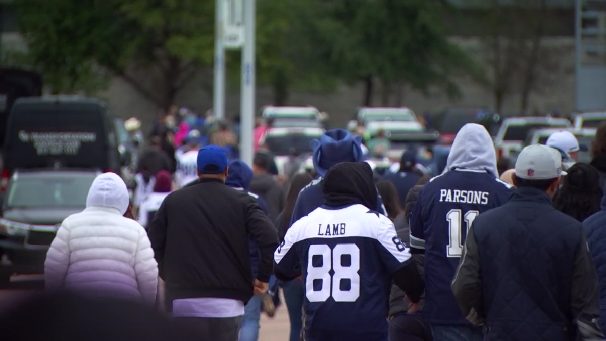 Fans bundle up for AT&T Stadium tailgate as cold front pushes through