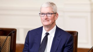 Apple CEO Tim Cook listens as President Joe Biden speaks during a roundtable with American and Indian business leaders in the East Room of the White House in Washington, D.C., June 23, 2023.