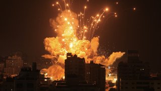 A missile explodes in Gaza City during an Israeli air strike on October 8, 2023.