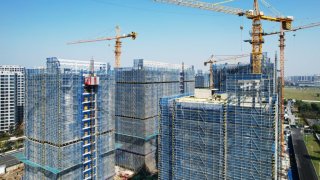 HANGZHOU, CHINA – NOVEMBER 15, 2023 – An aerial photo shows a new property under construction in Hangzhou City, Zhejiang Province, China, Nov 15, 2023. On the same day, data released by the National Bureau of Statistics showed that from January to October 2023, the national real estate development investment was 9,592.2 billion yuan, down 9.3% year on year; Of this total, the investment in residential housing was 7,279.9 billion yuan, down 8.8 percent. (Photo credit should read CFOTO/Future Publishing via Getty Images)