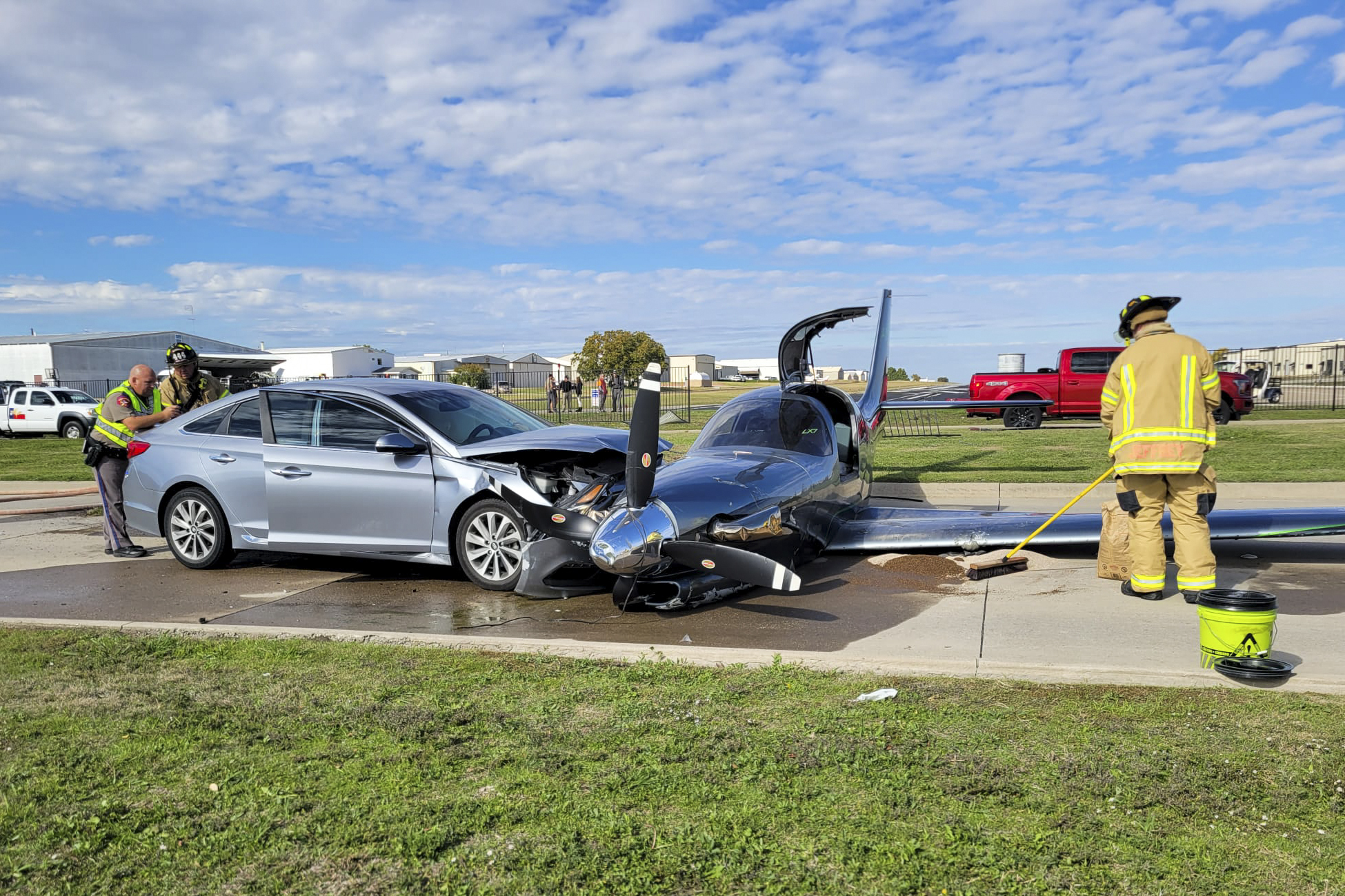 Small plane crashes into car during emergency landing in North