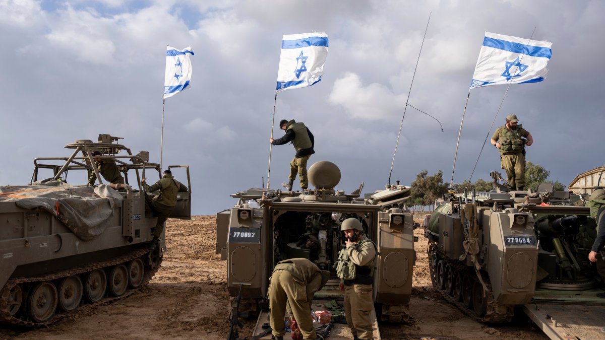 Israeli troops battle militants across north Gaza, which has been cut off from services for weeks