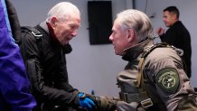 Texas Gov. Greg Abbott, right, prepares to skydive with 106-year-old World War II veteran Al Blaschke, left, Monday, Nov. 27, 2023, in Fentress, Texas. 