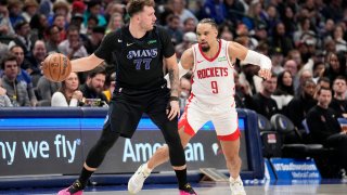 Dallas Mavericks guard Luka Doncic (77) works to get past Houston Rockets forward Dillon Brooks (9) in the first half of an NBA basketball game in Dallas, Tuesday, Nov. 28, 2023.