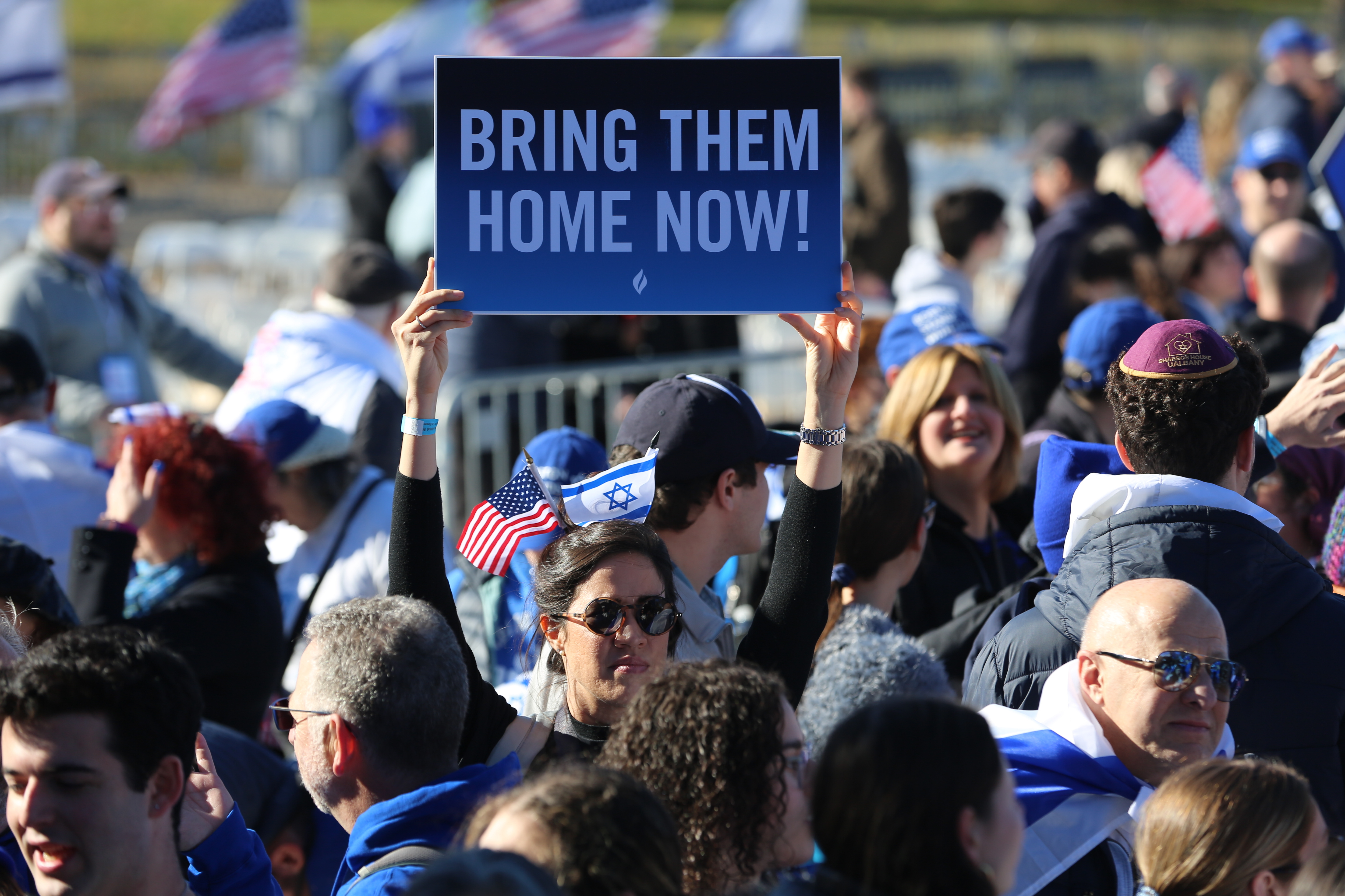 A protester raises a sign at the March for Israel at the National Mall on Tuesday, November 14, 2023 in Washington, DC.