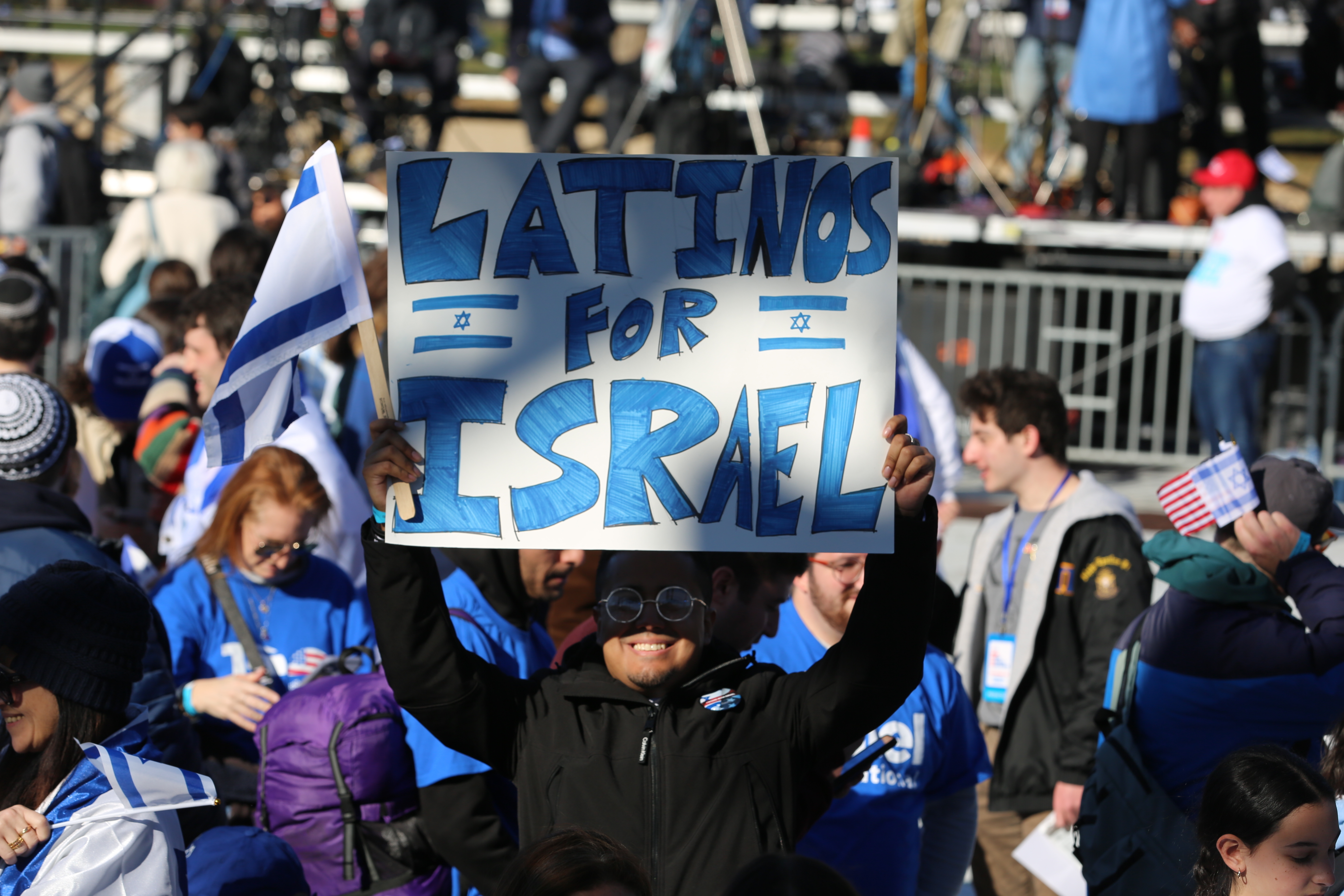 A protester raises a sign at the March for Israel at the National Mall on Tuesday, November 14, 2023 in Washington, DC.