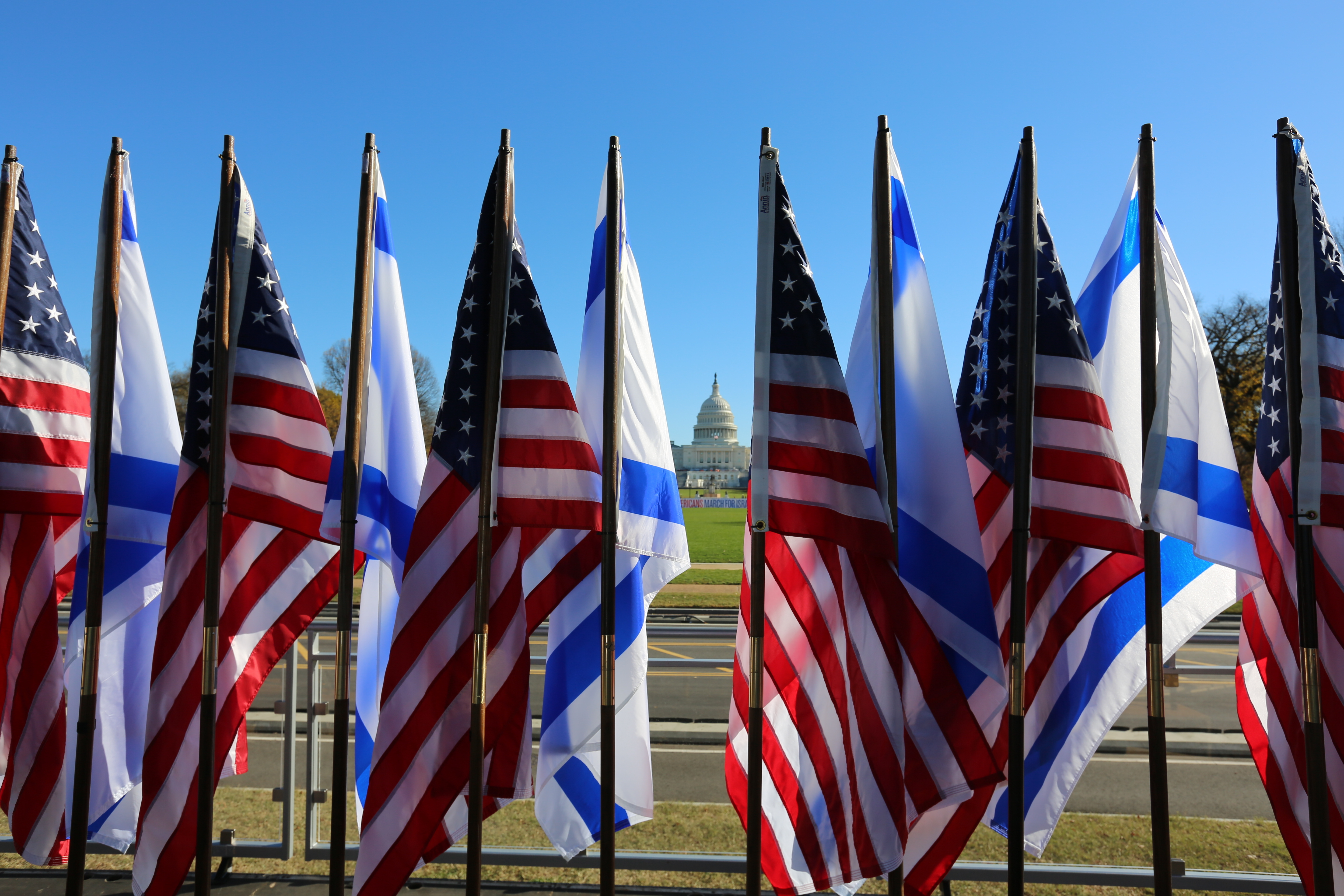 U.S. and Israeli flags fly in front of the Capitol at the March for Israel at the National Mall on Tuesday, November 14, 2023 in Washington, DC.