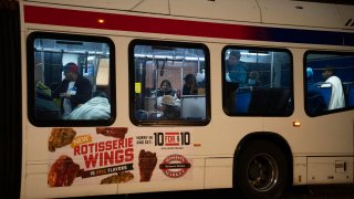 Migrants sent by Texas Gov. Greg Abbott arrive near 30th Street Station Wednesday morning, Nov. 16, 2022, in Philadelphia. Abbott has sent the buses to Democratic-led cities as a way to maximize exposure over what he says is inaction by the Biden administration over high numbers of migrants crossing on the southern border.