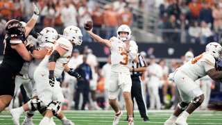 Texas quarterback Quinn Ewers throws a pass in the first half of the Big 12 Conference championship NCAA college football game against Oklahoma State in Arlington, Texas, Saturday, Dec. 2, 2023. (AP Photo/Tony Gutierrez)