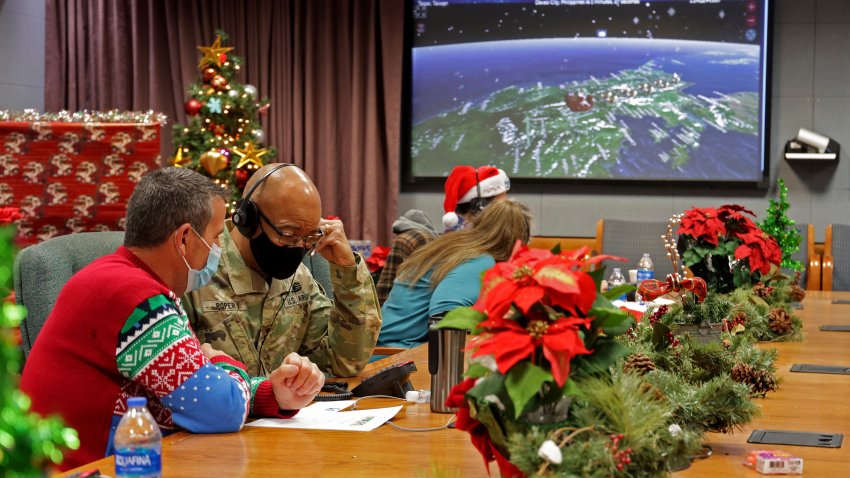 volunteers answering phones and emails from children around the globe during the annual NORAD Tracks Santa event