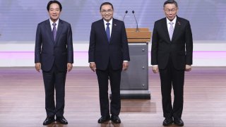 Taiwan President and Democratic Progressive Party presidential candidate William Lai, from left, Taiwan’s Nationalist Party presidential candidate Hou Yu-ih and Taiwan’s Taiwan People’s Party (TPP) presidential candidate Ko Wen-je pose before the presidential debates at Taiwan Public Television Service in Taipei, Taiwan, Saturday, Dec. 30, 2023. Taiwan will hold its presidential election on Jan. 13, 2024. (AP Photo/Pei Chen, Pool)