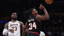 LOS ANGELES, CALIFORNIA - JANUARY 21: Jabari Walker #34 of the Portland Trail Blazers attempts a shot in front of LeBron James #23 of the Los Angeles Lakers during a 134-110 Lakers win at Crypto.com Arena on January 21, 2024 in Los Angeles, California. User is consenting to the terms and conditions of the Getty Images License Agreement. (Photo by Harry How/Getty Images)