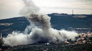 Smoke billows following Israeli bombardment in the village of Shihin in southern Lebanon near the border with Israel on February 13, 2024, amid ongoing cross-border tensions as fighting continues between Israel and Palestinian Hamas militants in the Gaza Strip.