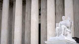 The Guardian of Law scuplture is seen at the west entrance of the Supreme Court on Thursday, Feb. 22, 2024, in Washington. (AP Photo/Mark Schiefelbein)