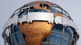 A globe sculpture featuring trucks traveling across it stands nears the World Trade International Bridge in Laredo, Texas, U.S., on Monday, June 10, 2019. Texas, which accounts for more than a third of U.S. trade with Mexico, would be hardest hit by any tariffs on the country. Photographer: Callaghan O’Hare/Bloomberg via Getty Images